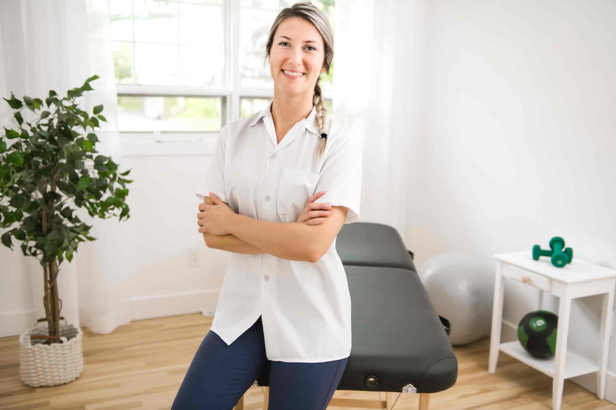 Physiotherapist referrals — knee surgery in Reading — Mr Sam Nahas Female physiotherapist in a clinic setting, portrait